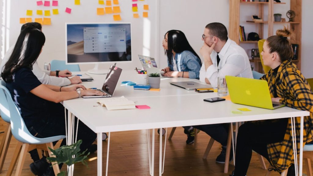 A team in an office discussing computer telephony integration during a meeting Telephony Integration