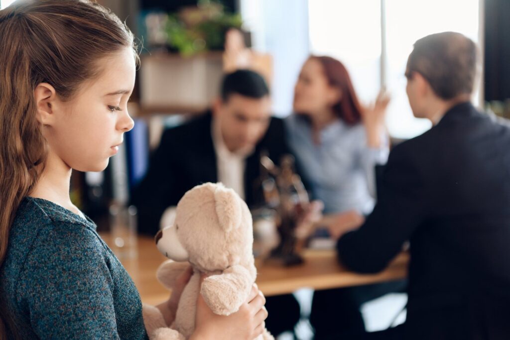 young girl looking sad for child's custody cases